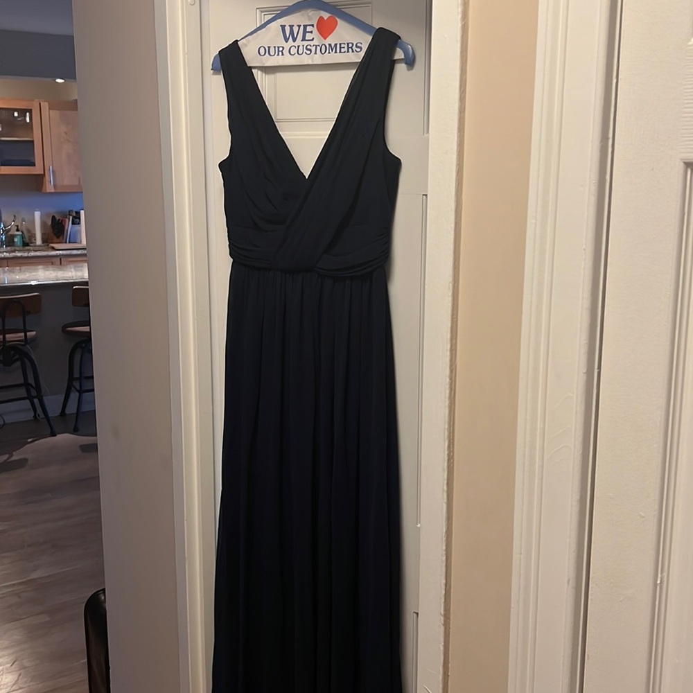 Navy blue bridesmaids gown worn once. In perfect condition. Size 6.